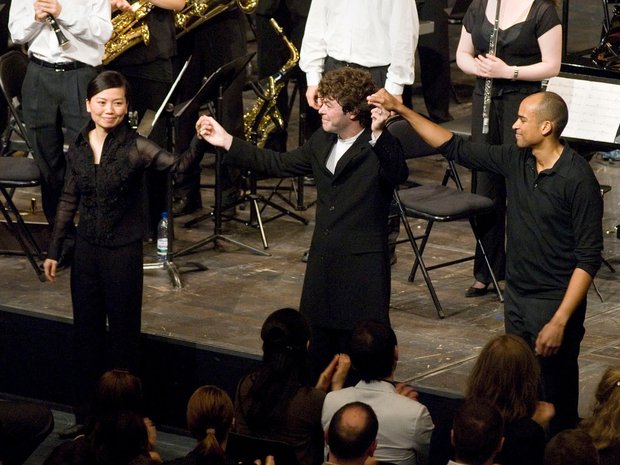 Applause for Lin Liao, Pablo Heras-Casado, and Kevin John Edusei after their performance of Stockhausen's "Gruppen"