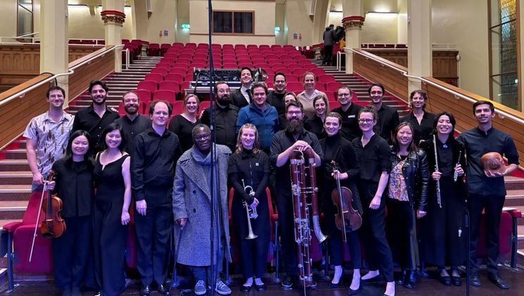 The Lucerne Festival Contemporary Orchestra with the backstage team, composers Liza Lim and Charles Uzor, and conductor Mariano Chiacchiarini © Huddersfield Contemporary Music Festival