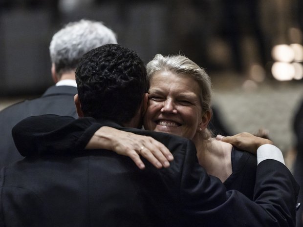 Musicians embrace after a great concert