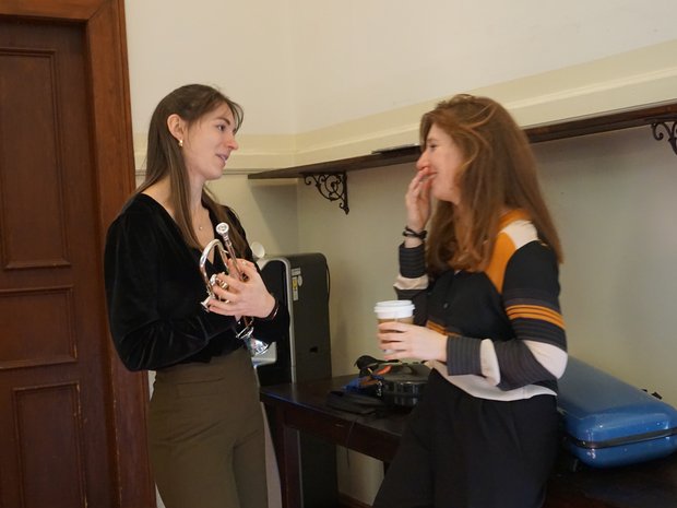 Lively conversation over a cup of coffee in between two rehearsal